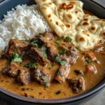 Creamy Coconut Curry Beef with Rice and Garlic Naan
